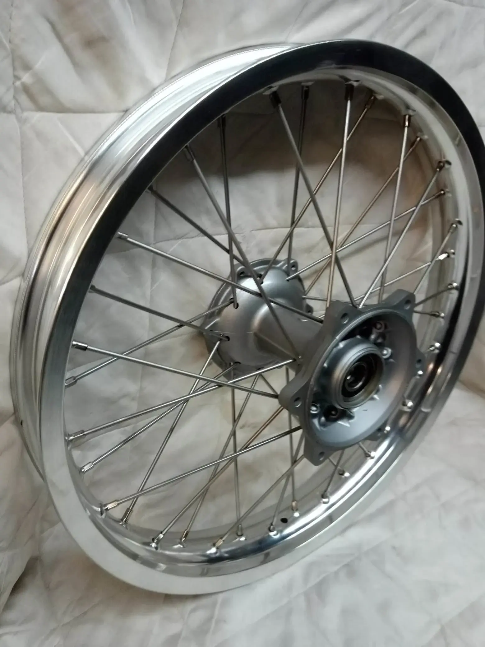 Finished respoked motorcycle wheel